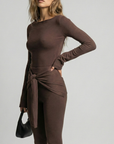 Romy Knit Pants in chocolate brown, featuring a high-waisted fit, soft knit fabric, and a front-tie detail for a stylish and comfortable look. Perfect for casual or elevated cozy outfits