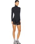 Nubyen Erin Overlay Leotard. Designed for style & performance, this versatile leotard features a chic overlay design that transitions seamlessly from workout to casual wear. Crafted from high-quality, breathable, & stretchable fabric, it provides optimal comfort and support for activewear dance, or fitness routines. Ethically made, the Erin Overlay Leotard combines elegance with functionality, empowering you to move confidently. Perfect for those who value fashion-forward activewear that embodies excellence