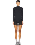 Nubyen Erin Overlay Leotard. Designed for style & performance, this versatile leotard features a chic overlay design that transitions seamlessly from workout to casual wear. Crafted from high-quality, breathable, & stretchable fabric, it provides optimal comfort and support for activewear dance, or fitness routines. Ethically made, the Erin Overlay Leotard combines elegance with functionality, empowering you to move confidently. Perfect for those who value fashion-forward activewear that embodies excellence