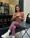 Nubyen I am prosperous Lleida High-Rise V-Wrap Legging women’s sculpting high-waisted leggings with V-wrap waistband and contour performance fabric.