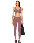 Nubyén Lleida High Rise Surplice Front V Wrap Legging is perfect for a flattering fit and elevated style. Designed with a high-rise waistband and surplice V front wrap, these leggings offer comfort and flexibility for both activewear and casual wear