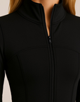 Nubyen Higher Dominion Capsule Sculpt Jacket women’s sculpting activewear jacket with contour fit, waist-cinching design, and premium technical performance fabric.