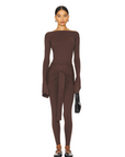 Romy Knit Pants in chocolate brown, featuring a high-waisted fit, soft knit fabric, and a front-tie detail for a stylish and comfortable look. Perfect for casual or elevated cozy outfits
Romy Knit Top styled in a minimalist setting. Featuring a sleek, fitted design with a boat neckline and ribbed texture, it exudes contemporary elegance. Soft lighting and neutral tones enhance its sophisticated appeal."