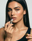 Achieve fuller lips with Nubyén Super Nudes Plumping Lipstick. Vegan, cruelty-free, moisture-matte lipstick infused with peppermint, eucalyptus, lemongrass, and collagen to enhance lip volume naturally. Available in 10 flattering nude shades, perfect for a soft, plump, kissable pout. Safe to use with or without fillers. Clean beauty formula, free of parabens, sulfates, and phthalates.