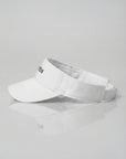 White NUBYÉN premium cotton visor featuring embroidered logo, curved brim and adjustable fit for women's luxury sportswear and everyday wear.