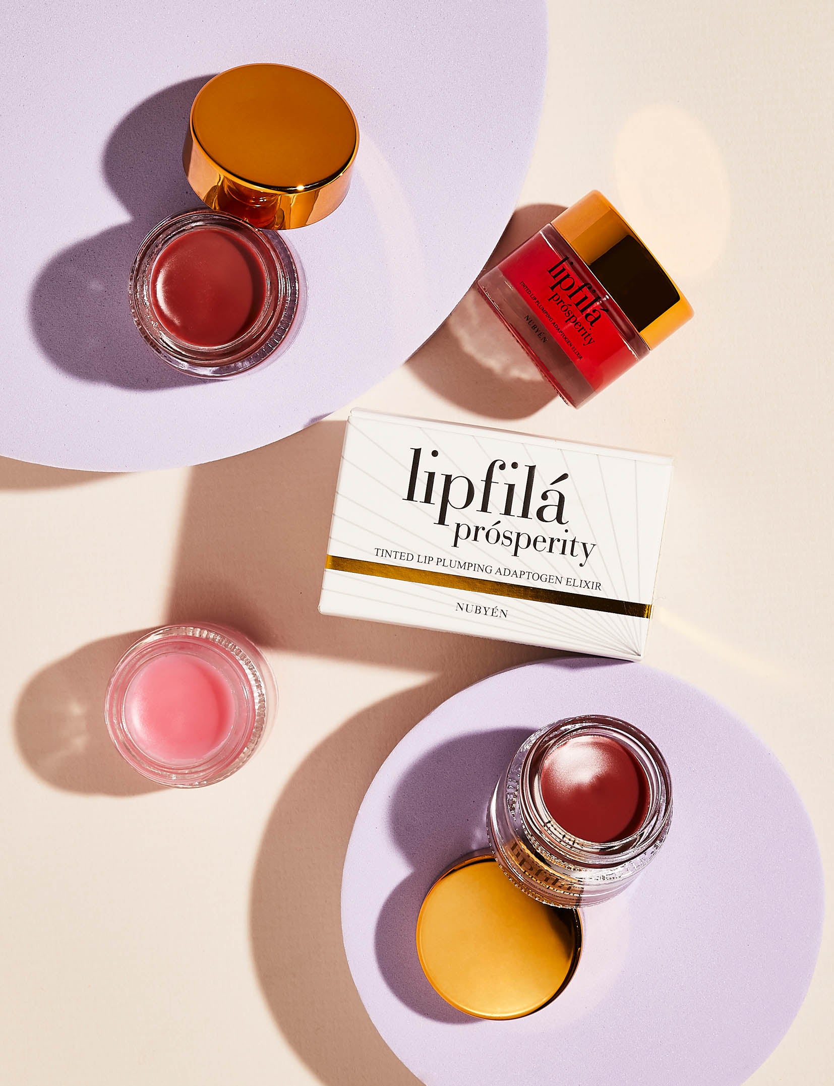 Enhance lip volume with Nubyén Lip Prosperity Tinted Plumping Balm – plant-based lip plumper with cinnamon, Reishi mushroom, lemongrass, and AHAs. Vegan, cruelty-free, recyclable, and free from parabens and sulfates. Instantly hydrates, boosts natural color, and adds a subtle tint for fuller, kissable lips