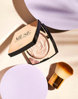 Nubyen Muse Highlighting Powder – vegan, cruelty-free highlighter with handcrafted light-reflecting pearl pigments for a radiant glow. Enhances complexion, blurs fine lines, and adds a subtle shimmer