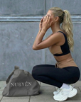 Model wearing Nubyen Abundance  Vigo Tie-Up Leggings flattering high-rise sculpt leggings with adjustable tie waist for Pilates, gym, and everyday athleisure leggings 