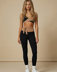 Model wearing Nubyen Abundance  Vigo Tie-Up Leggings flattering high-rise sculpt leggings with adjustable tie waist for Pilates, gym, and everyday athleisure leggings 