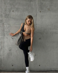 Model wearing Nubyen Abundance  Vigo Tie-Up Leggings flattering high-rise sculpt leggings with adjustable tie waist for Pilates, gym, and everyday athleisure leggings 
