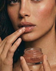 Enhance lip volume with Nubyén Lip Prosperity Tinted Plumping Balm – plant-based lip plumper with cinnamon, Reishi mushroom, lemongrass, and AHAs. Vegan, cruelty-free, recyclable, and free from parabens and sulfates. Instantly hydrates, boosts natural color, and adds a subtle tint for fuller, kissable lips