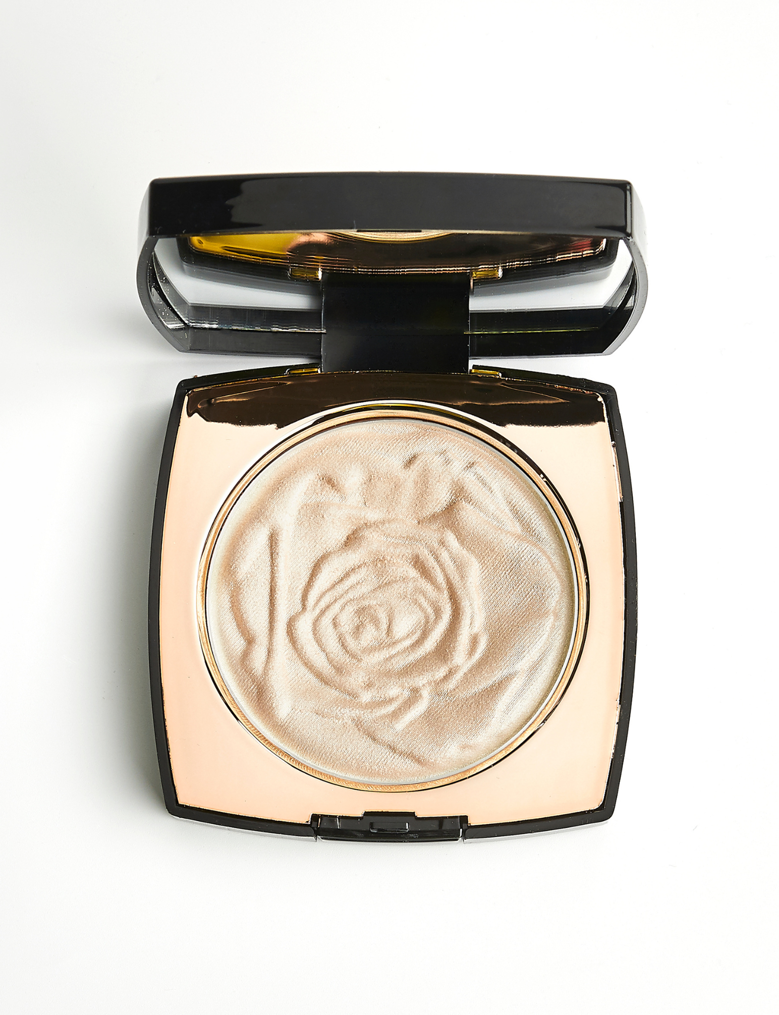 Nubyen best selling  Muse Highlighter shown in its compact, a natural radiant highlighter with papaya fruit extract that brightens the skin and delivers a seamless glow.