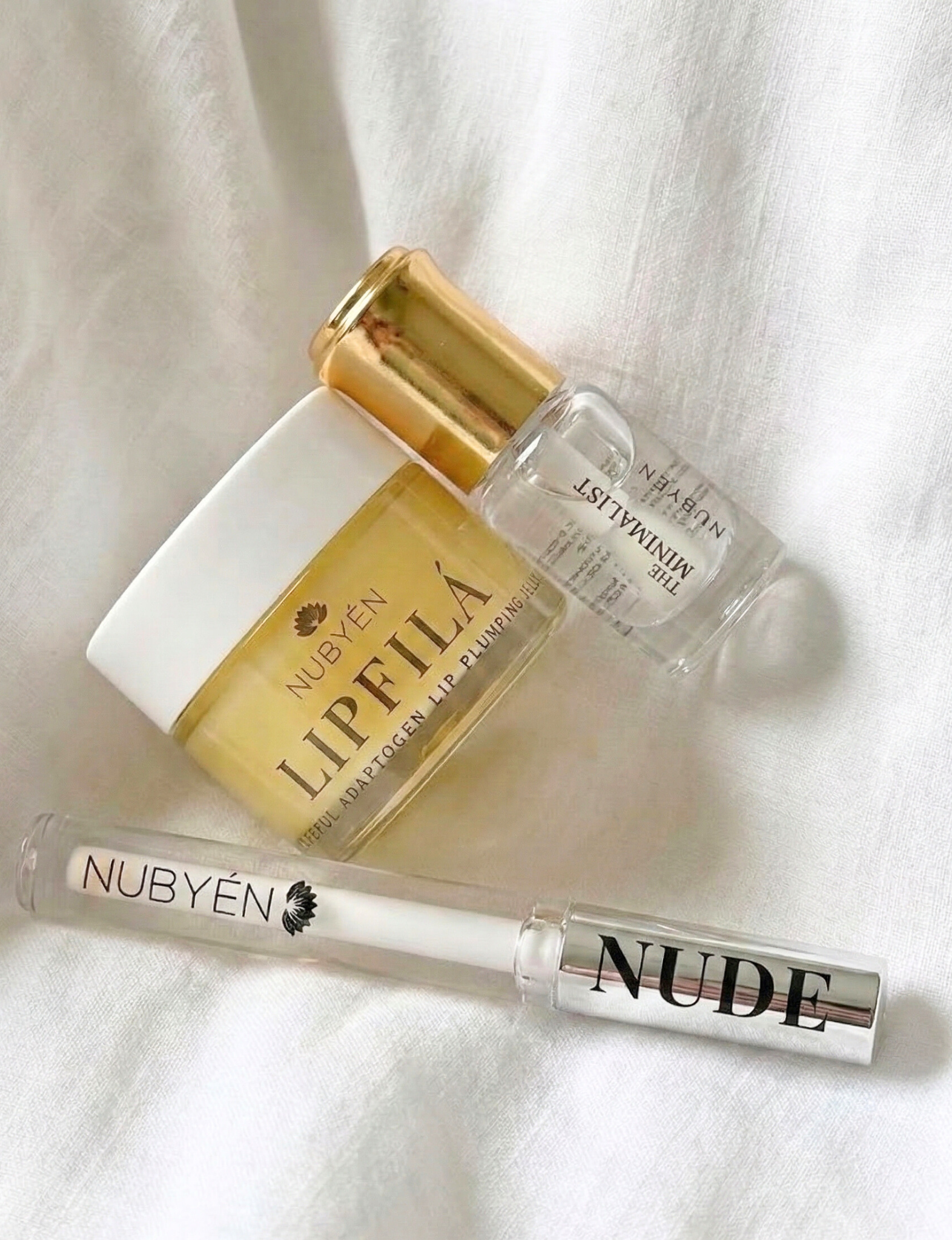 Achieve fuller lips with Nubyén Super Nudes Plumping Lipstick. Vegan, cruelty-free, moisture-matte lipstick infused with peppermint, eucalyptus, lemongrass, and collagen to enhance lip volume naturally. Available in 10 flattering nude shades, perfect for a soft, plump, kissable pout. Safe to use with or without fillers. Clean beauty formula, free of parabens, sulfates, and phthalates.