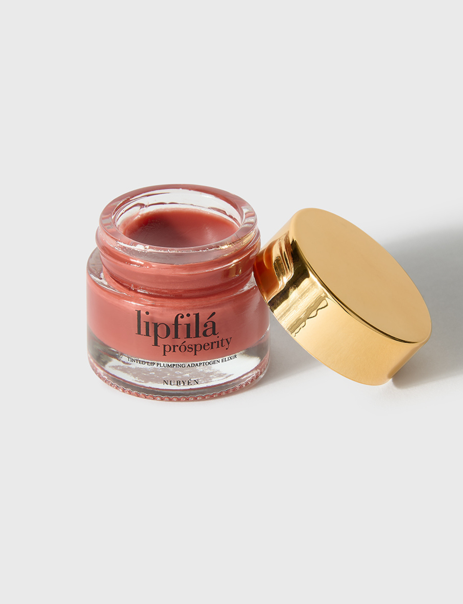 Enhance lip volume with Nubyén Lip Prosperity Tinted Plumping Balm – plant-based lip plumper with cinnamon, Reishi mushroom, lemongrass, and AHAs. Vegan, cruelty-free, recyclable, and free from parabens and sulfates. Instantly hydrates, boosts natural color, and adds a subtle tint for fuller, kissable lips