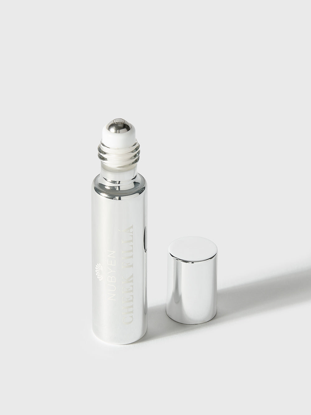 Enhance your cheekbones naturally with Nubyen Cheek Fillá, a clean, vegan cheek-lifting elixir enriched with hyaluronic acid, cinnamon, and AHA fruit extracts for hydration, plumping, and brightening. Perfect for sculpted, radiant cheeks without injections. Eco-friendly glass packaging.