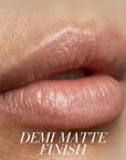Close-up of lips wearing a semi-matte lip product, with the text 'DEMI MATTE FINISH' overlaid at the bottom.