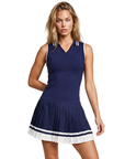 The Nubyen Prosperity Pleated Tennis Dress is a luxury women’s tennis dress designed with a sculpting silhouette, elegant pleated detailing, and elevated performance fabric for refined movement on and off the court. Inspired by contemporary racket sports fashion and minimalist athletic styling, this premium activewear piece blends modern femininity with functional comfort. The streamlined fit enhances confidence and flexibility, making it ideal for tennis, padel, wellness lifestyles, and luxury everyday spo