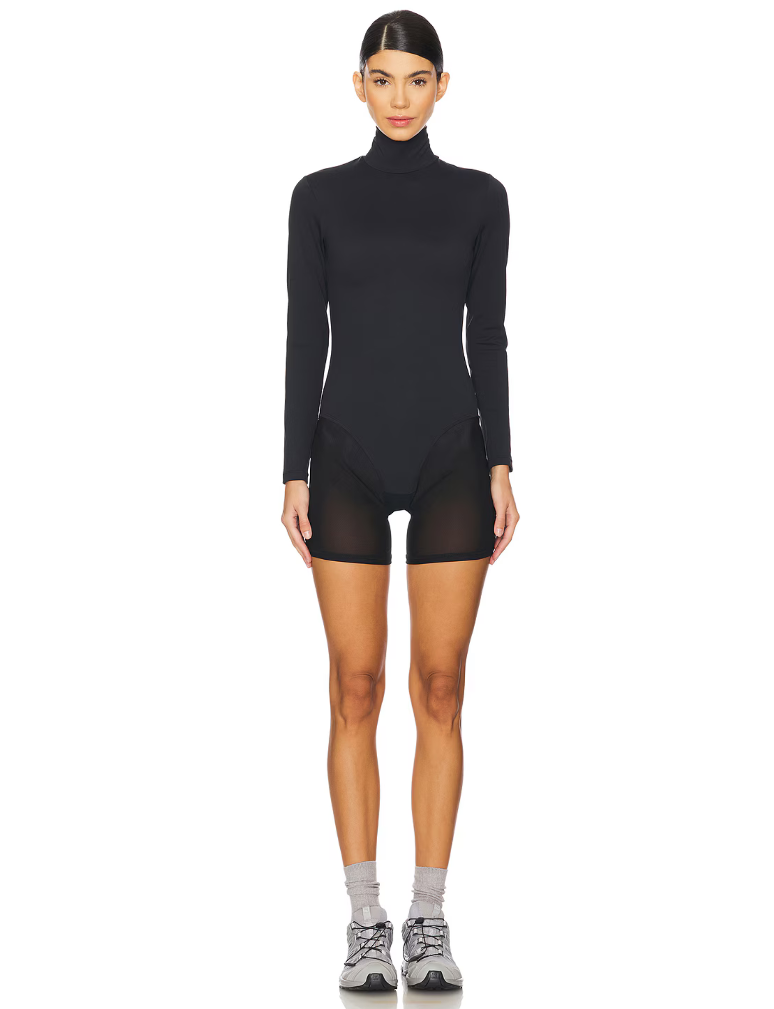 Erin Michelle Mesh Short Leotard in black, featuring a high-neck design, long fitted sleeves, and semi-sheer mesh shorts for a modern, sleek look. Perfect for layering, dancewear, or contemporary styling.