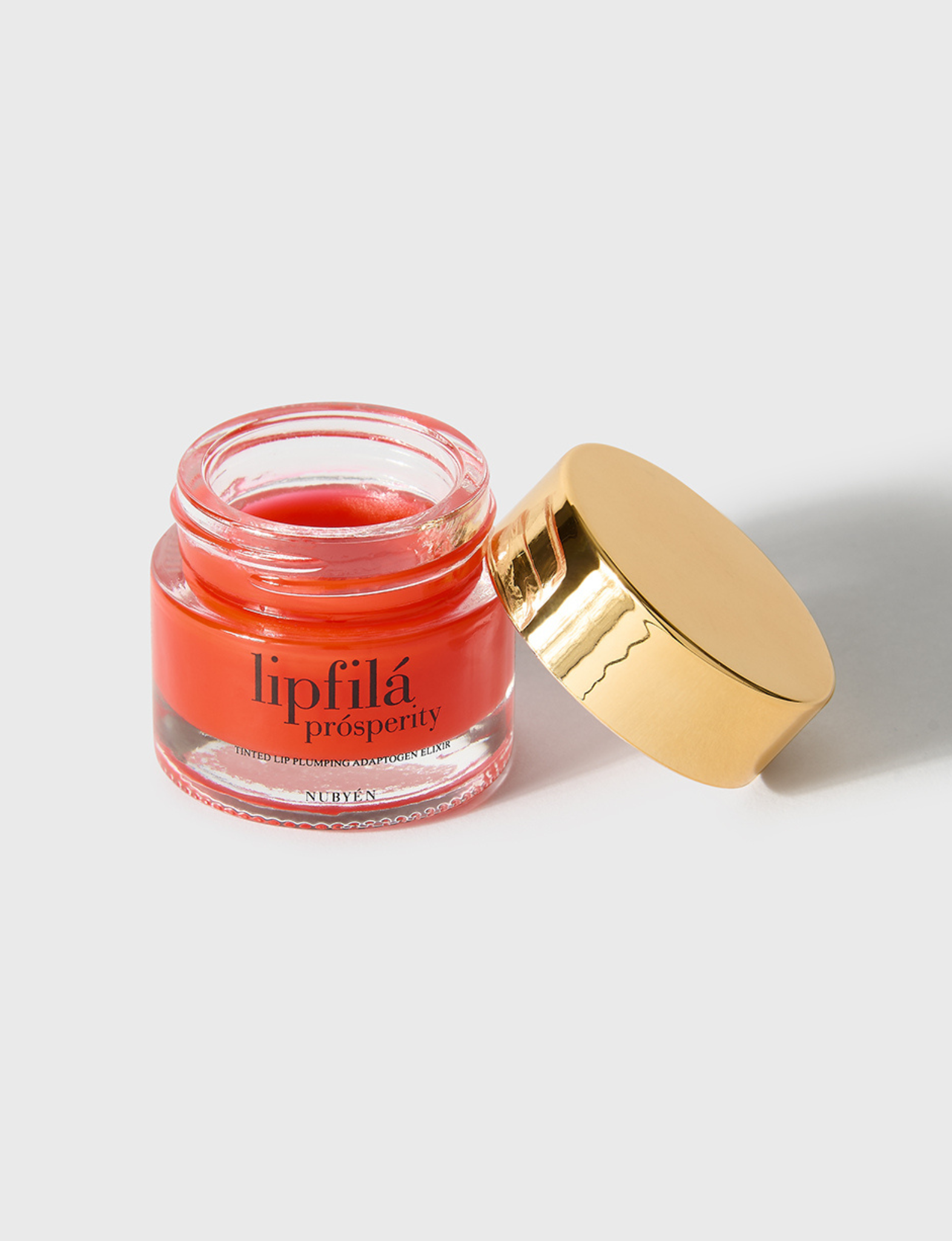 Enhance lip volume with Nubyén Lip Prosperity Tinted Plumping Balm – plant-based lip plumper with cinnamon, Reishi mushroom, lemongrass, and AHAs. Vegan, cruelty-free, recyclable, and free from parabens and sulfates. Instantly hydrates, boosts natural color, and adds a subtle tint for fuller, kissable lips