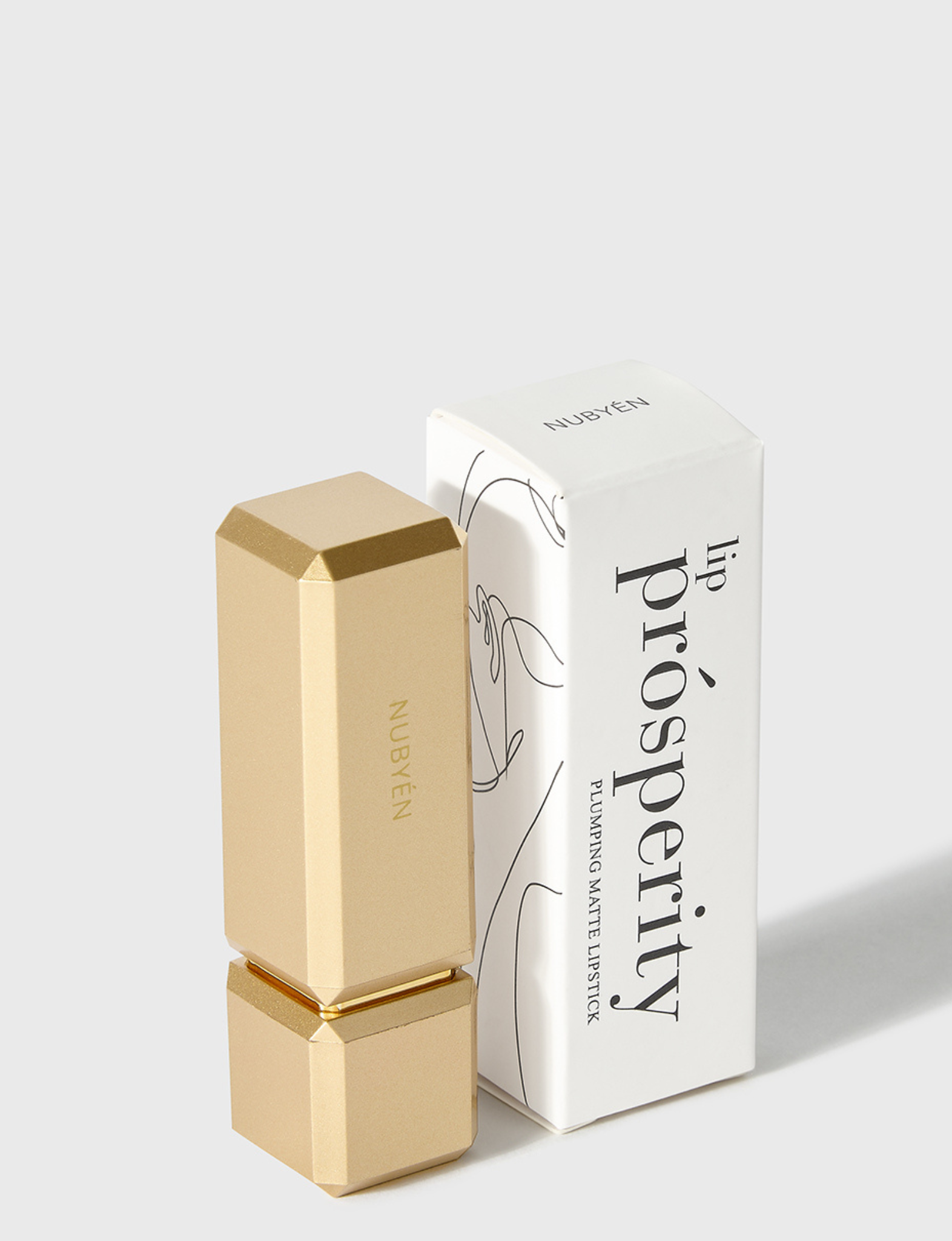 Nubyén Lip Prosperity Plumping Matte Lipstick – A luxurious matte lipstick that plumps, hydrates, and enhances lip volume naturally. Infused with nourishing ingredients like hyaluronic acid and cinnamon, it delivers bold, long-lasting color while keeping lips smooth and moisturized. 100% vegan, cruelty-free, and free from parabens and sulfates, this lipstick is perfect for fuller, healthier-looking lips. Created by medical professionals, it combines beauty and science for confident, radiant results