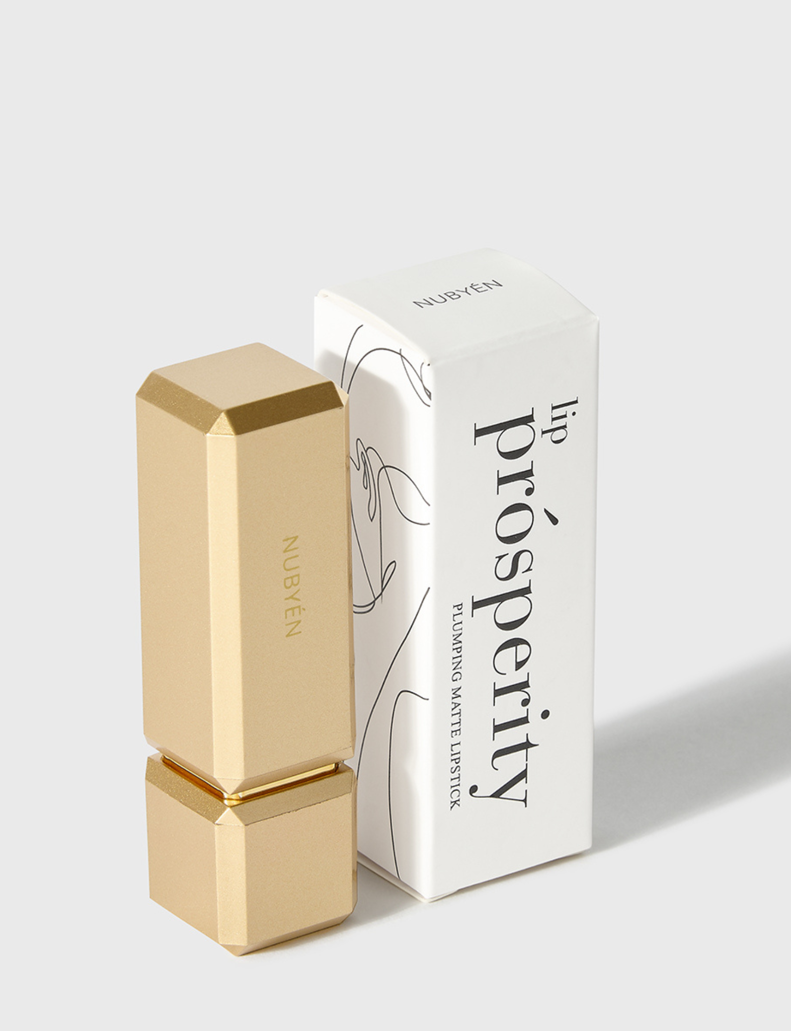 Nubyén Lip Prosperity Plumping Matte Lipstick – A luxurious matte lipstick that plumps, hydrates, and enhances lip volume naturally. Infused with nourishing ingredients like hyaluronic acid and cinnamon, it delivers bold, long-lasting color while keeping lips smooth and moisturized. 100% vegan, cruelty-free, and free from parabens and sulfates, this lipstick is perfect for fuller, healthier-looking lips. Created by medical professionals, it combines beauty and science for confident, radiant results