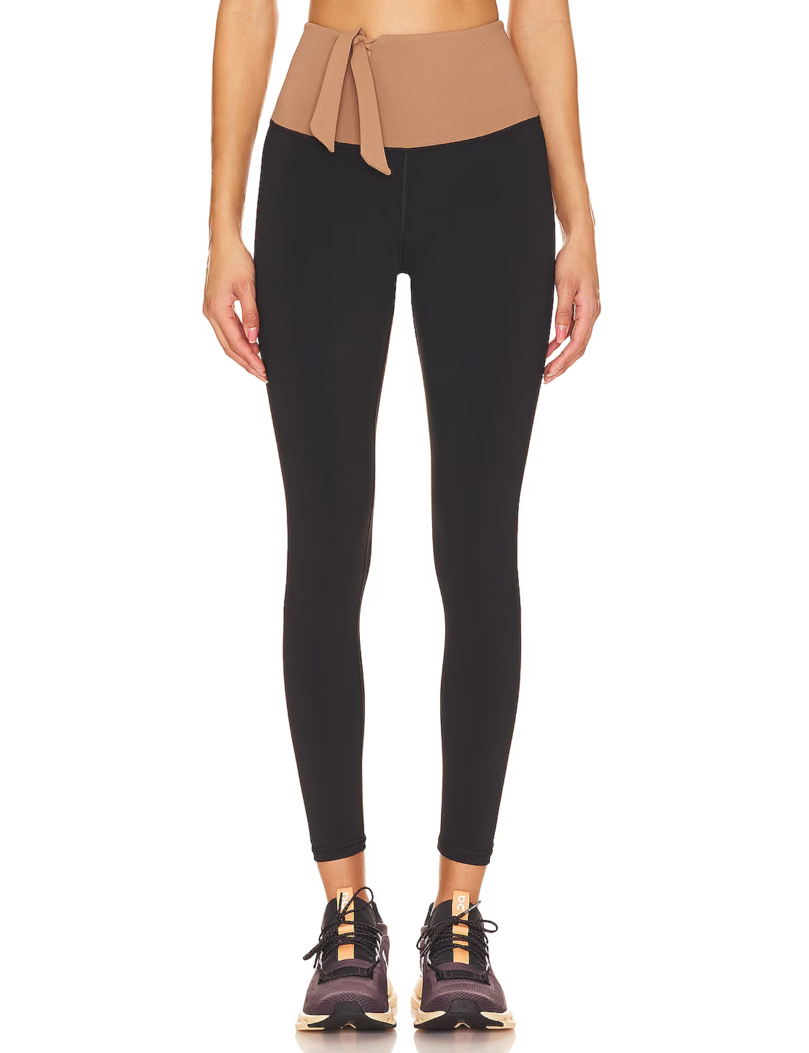 High-rise leggings with adjustable tie-up details at the waist for a customizable fit and stylish touch. The Nubyen Alicante Vigo leggings feature a sleek silhouette, smooth fabric, and a modern design perfect for activewear or casual chic outfits.
