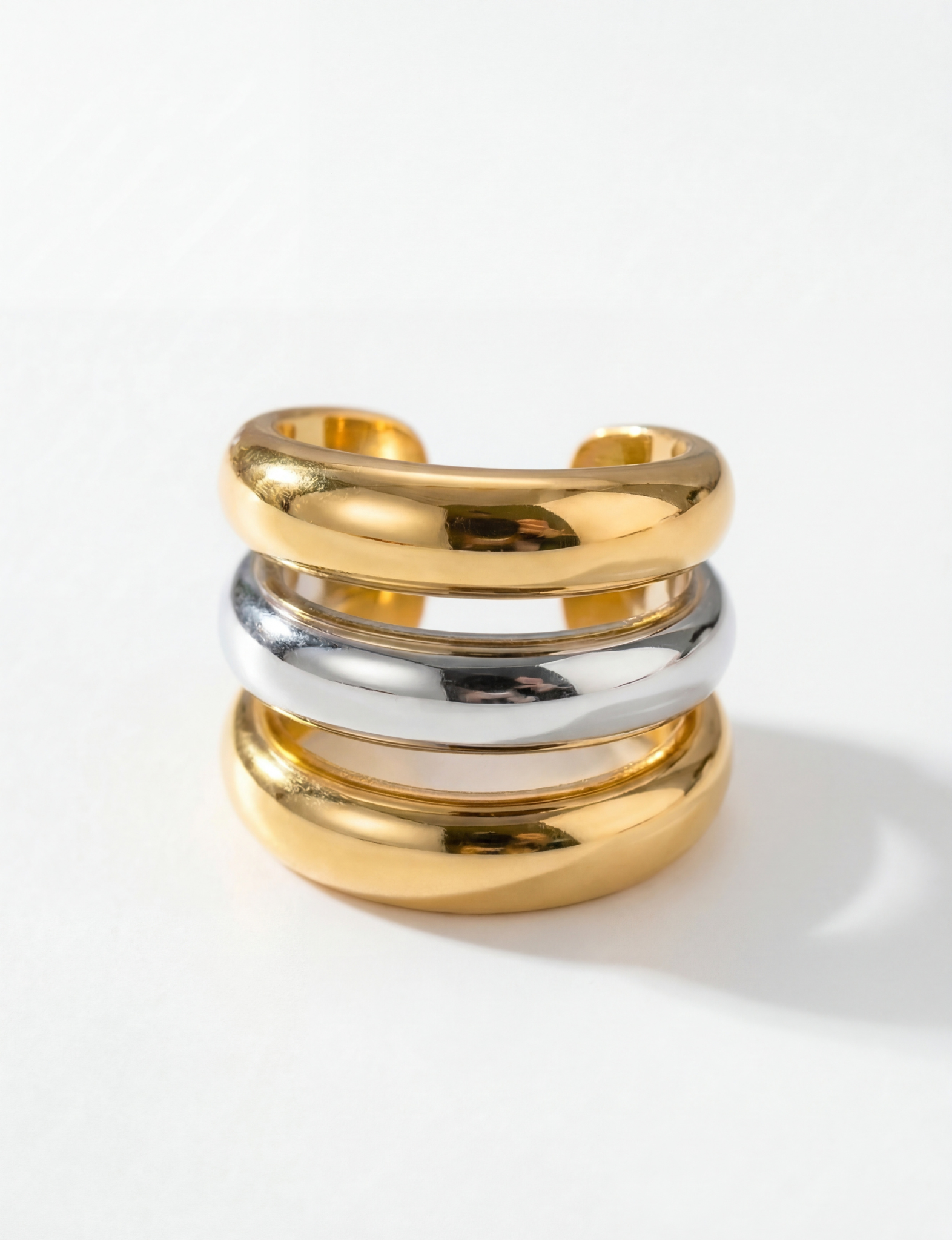 Nubyen Joy two tone chain cuff ring in silver and 18k gold plating with sculptural open cuff silhouette
Luxury two tone statement ring by Nubyen featuring mixed metal gold and silver adjustable cuff design
Sculptural gold and silver cuff ring with fluid open-back silhouette by Nubyen