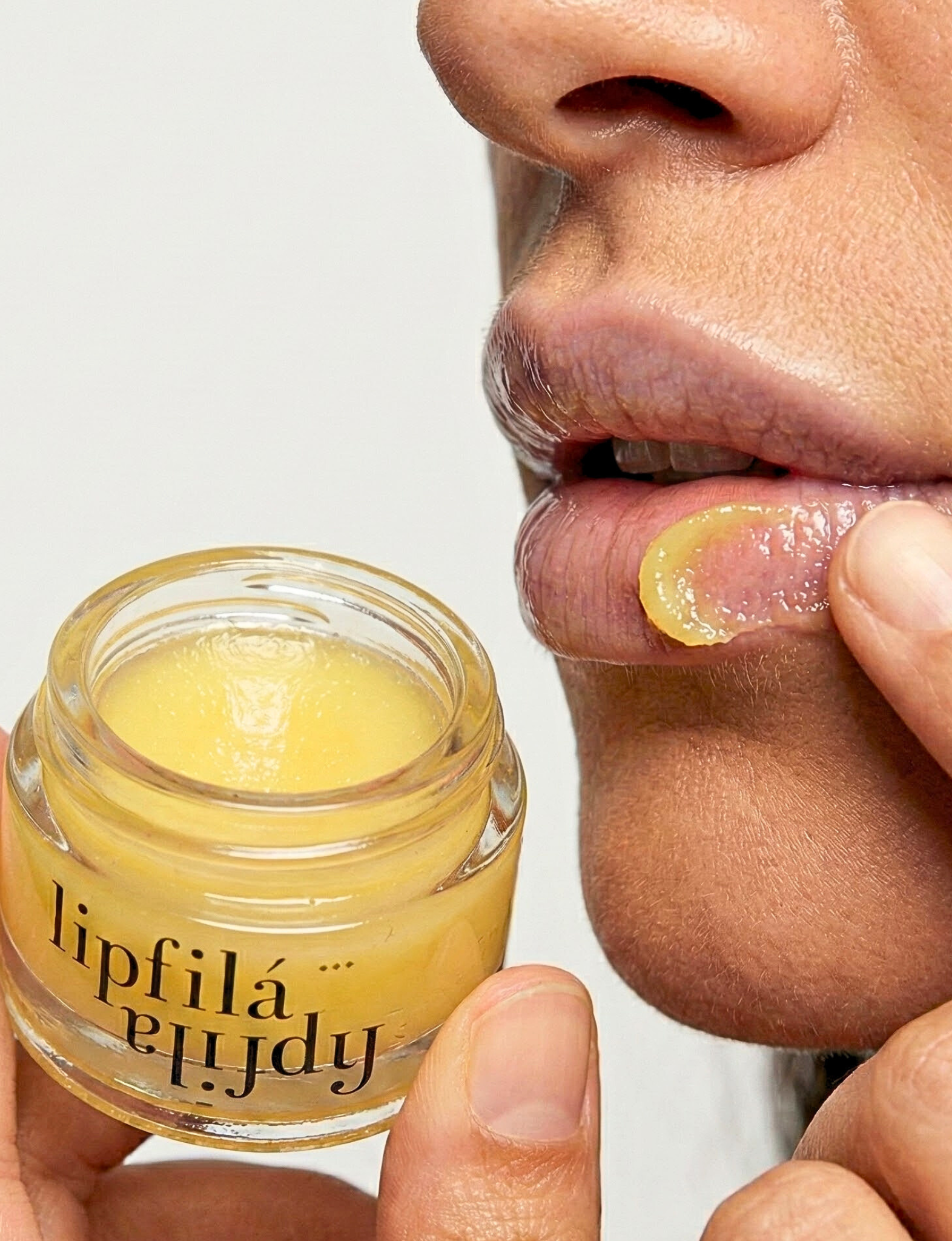 Experience visibly fuller lips with Nubyen Lip Filá+ Adaptogen Plumping Balm. Enriched with natural menthol, cinnamon, marine algae collagen, and hyaluronic acid for hydration, volume, and a plump, smooth finish. Vegan, cruelty-free, and clean beauty formula free of parabens, sulfates, and phthalates. Suitable for use with or without lip fillers. Achieve a naturally enhanced pout effortlessly