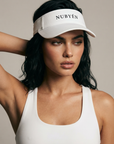 White NUBYÉN premium cotton visor featuring embroidered logo, curved brim and adjustable fit for women's luxury sportswear and everyday wear.