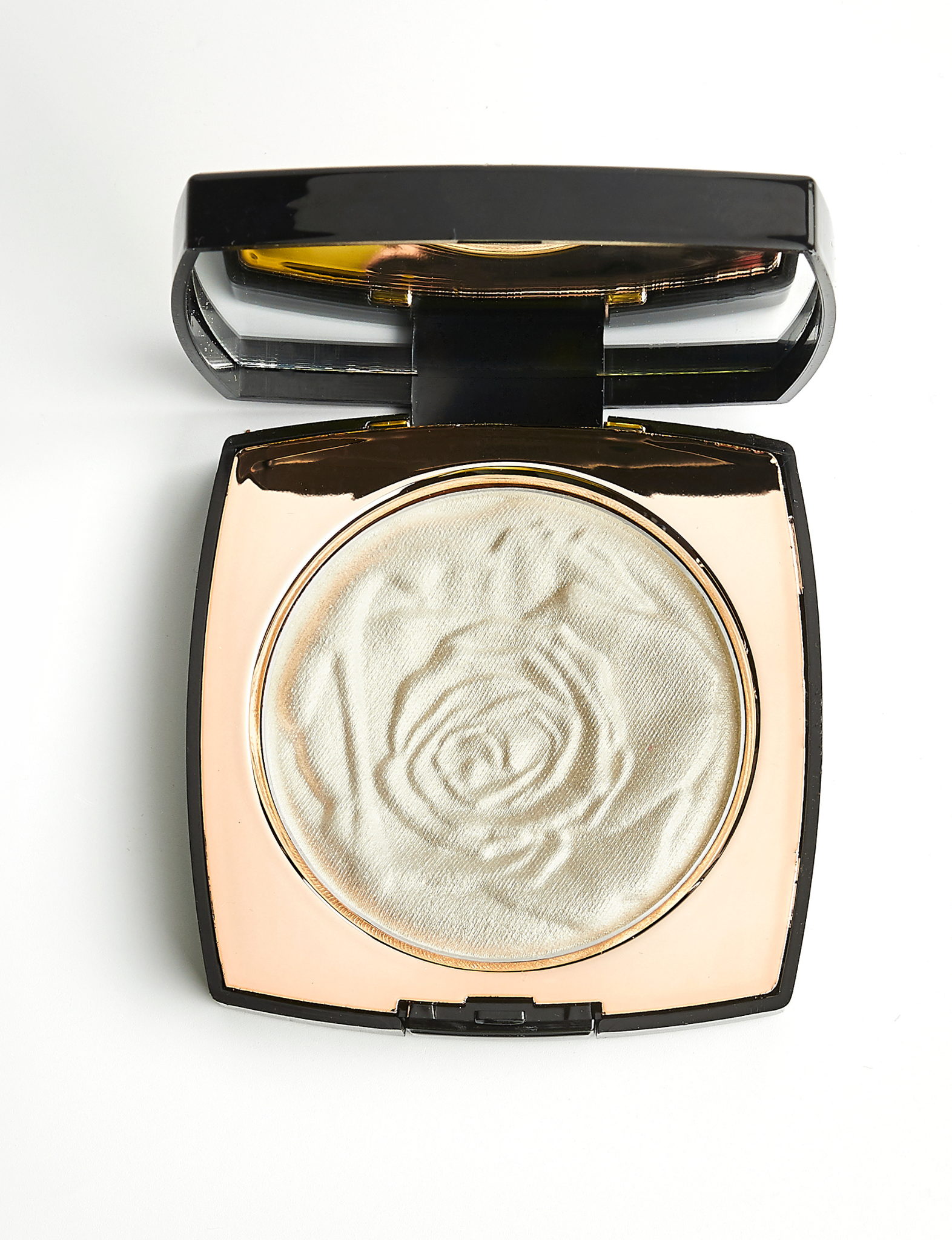 Nubyen best selling  Muse Highlighter shown in its compact, a natural radiant highlighter with papaya fruit extract that brightens the skin and delivers a seamless glow.