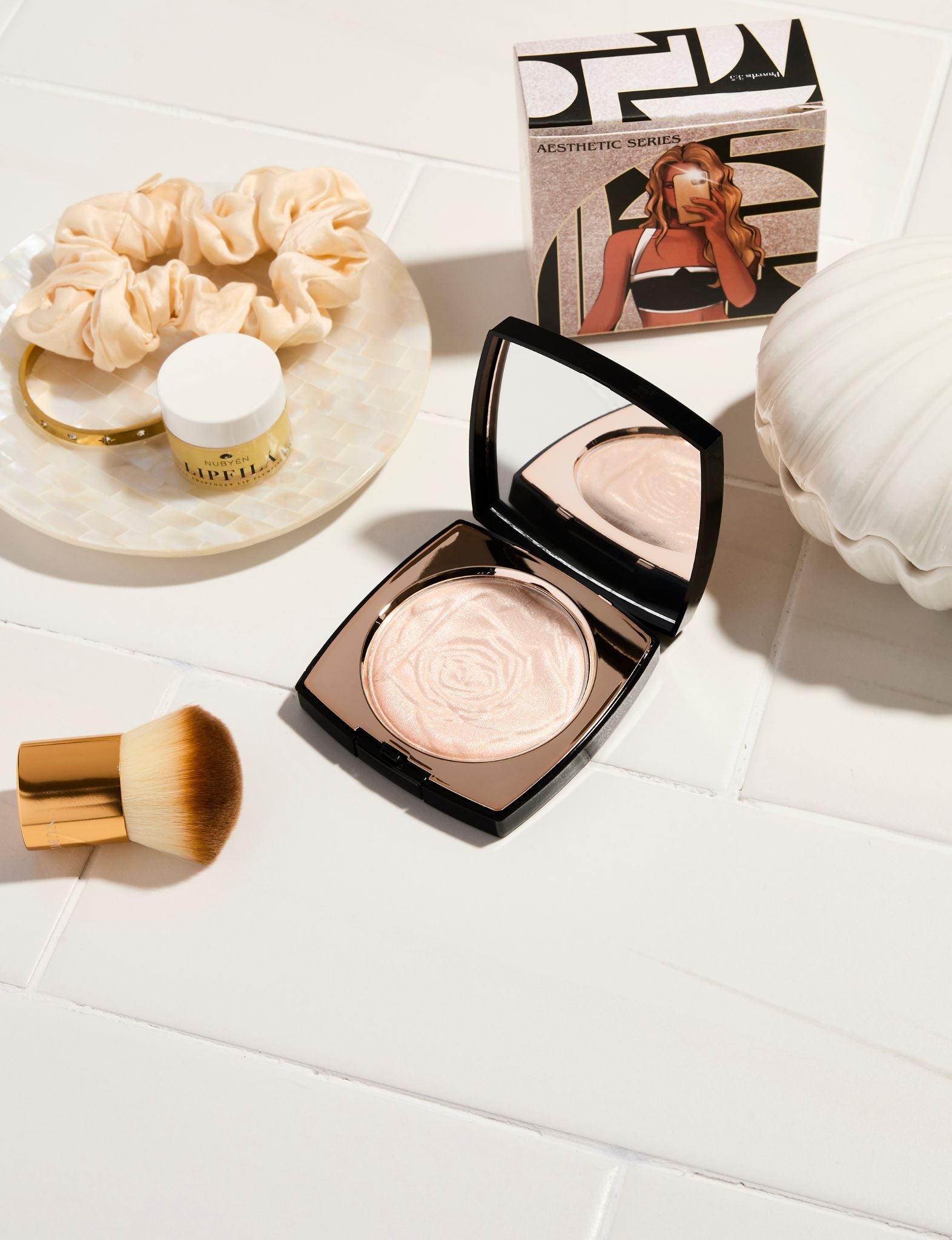 Nubyén Papaya Infused Highlighter Powder for radiant, glowing skin. Vegan, cruelty-free, and free from parabens. Adds dimension and blurs fine lines for a smooth, lifted complexion. Ideal for face and body use.