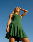 The Nubyen Radiance Flared Tennis Dress is a luxury women’s tennis dress designed with a sculpting fitted bodice, elegant flared skirt silhouette, and premium performance fabric for effortless movement and elevated court style. Inspired by contemporary racket sports fashion and minimalist wellness aesthetics, this modern activewear dress blends feminine tailoring with functional comfort for tennis, padel, pilates, and luxury everyday wear. The streamlined silhouette enhances confidence while delivering refi