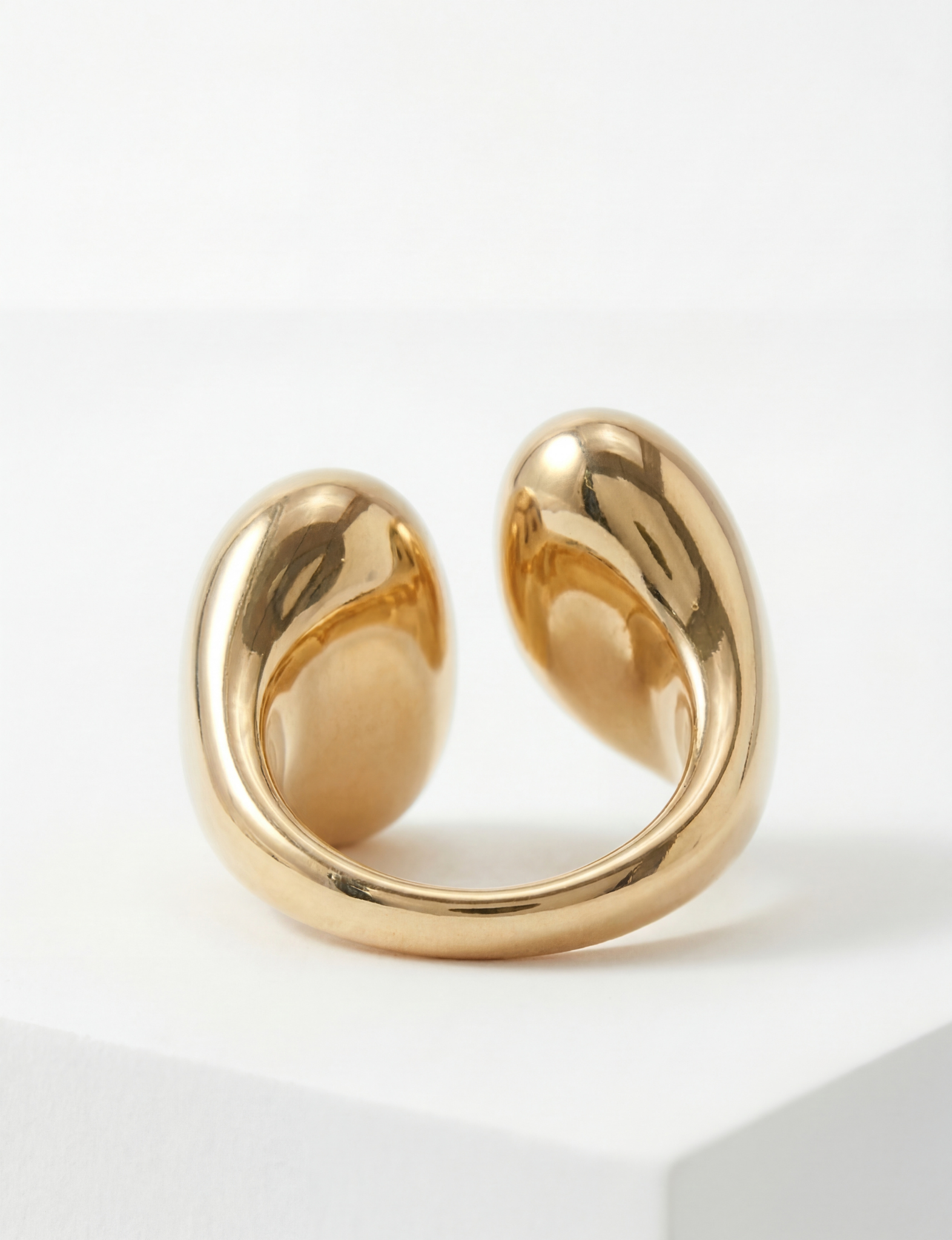 The Nubyen Joy Two Tone Chain Cuff Ring is a sculptural luxury statement ring featuring a bold mixed-metal design that fuses polished silver and radiant 18k gold plating into one fluid silhouette. Designed with an adjustable open-back cuff fit, this contemporary two tone ring delivers elevated modern elegance with a chunky chain-inspired aesthetic. Perfect for stacking or standalone styling, the Joy ring embodies refined confidence, editorial minimalism, and timeless luxury jewellery design.