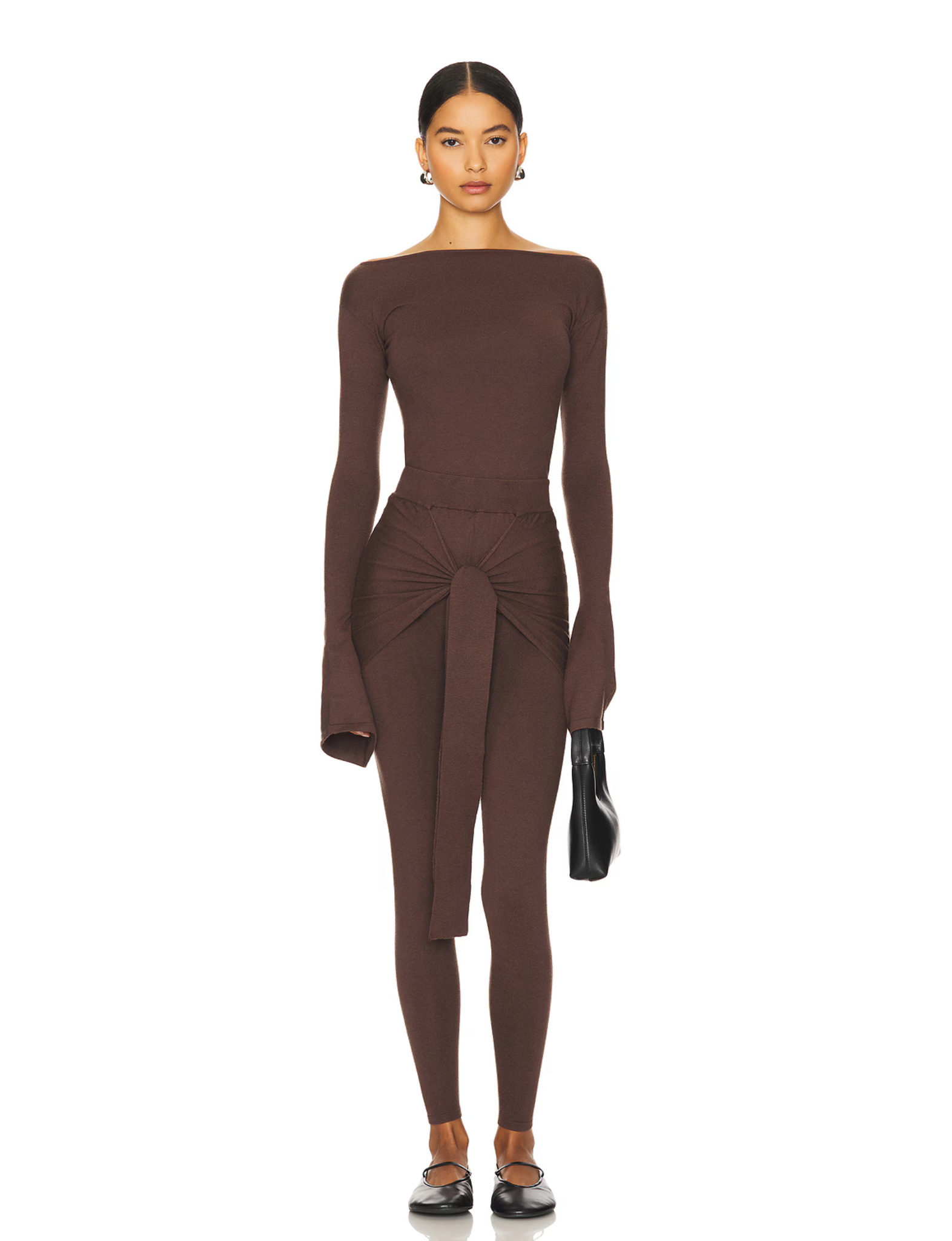 Romy Knit Pants in chocolate brown, featuring a high-waisted fit, soft knit fabric, and a front-tie detail for a stylish and comfortable look. Perfect for casual or elevated cozy outfits

Romy Knit Top styled in a minimalist setting. Featuring a sleek, fitted design with a boat neckline and ribbed texture, it exudes contemporary elegance. Soft lighting and neutral tones enhance its sophisticated appeal."