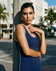 The Nubyen Triumph V-Neck Low Back Mini Dress is a luxury women’s mini dress designed with a sculpting V-neck silhouette, elegant low-back detailing, and refined minimalist tailoring. Crafted for elevated day-to-night styling, the fitted silhouette contours the body while maintaining effortless sophistication. Inspired by contemporary editorial fashion and modern femininity, this sleek black mini dress blends confidence, movement, and timeless elegance with a clean luxury aesthetic perfect for evenings, eve