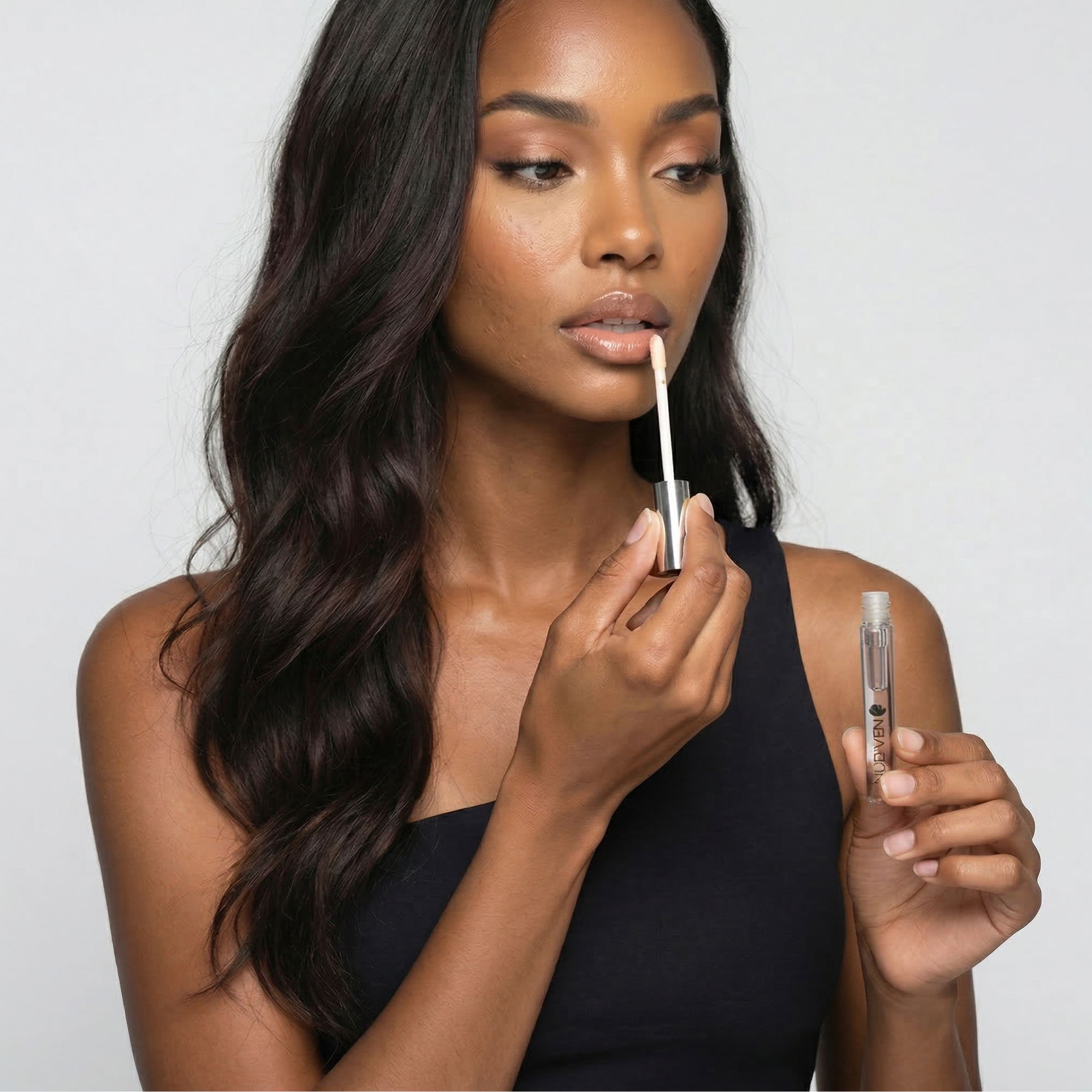 Nubyén Nude Lip Plumping Augmentation Gloss -best safe, reversible lip plumper and a natural alternative to fillers for fuller lips.Nubyen lip plumper, best lip plumper, lip plumping gloss, nubyen lip plumping balm, lip plumping balm, This Lip plumping gloss Nubyen Nude, its our best selling vegan and cruelty free gloss for fuller lips instantly, has natural ingredients such as collagen &amp; hyaluronic acid, best lip plumping lipgloss, best lip plumper, lip filler, full lips, lip injections, to faced lip