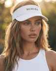 White NUBYÉN premium cotton visor featuring embroidered logo, curved brim and adjustable fit for women's luxury sportswear and everyday wear.