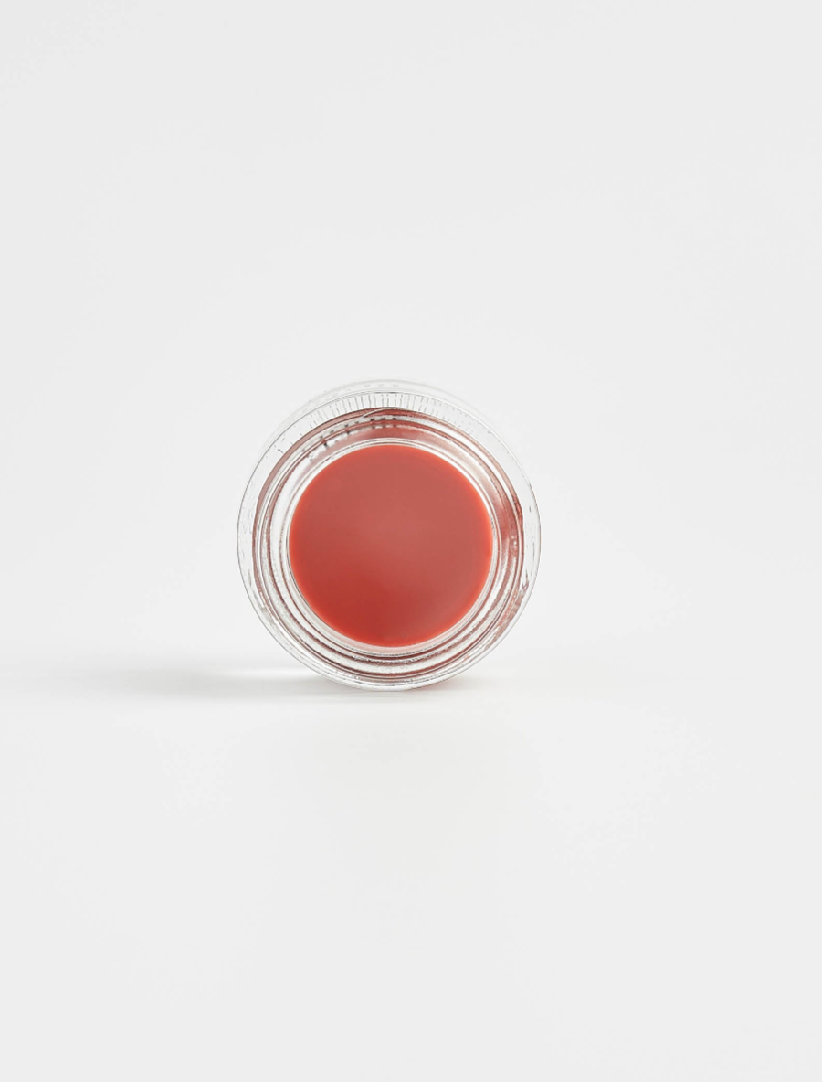 Vegan lip plumping balm by Nubyén for fuller, hydrated lips with plant-based lemongrass and AHAs. Clean, cruelty-free beauty in recyclable glass jars. Safe alternative to lip fillers with pigmented color.