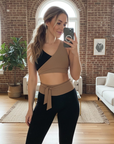 Model wearing Nubyen Abundance  Vigo Tie-Up Leggings flattering high-rise sculpt leggings with adjustable tie waist for Pilates, gym, and everyday athleisure leggings 