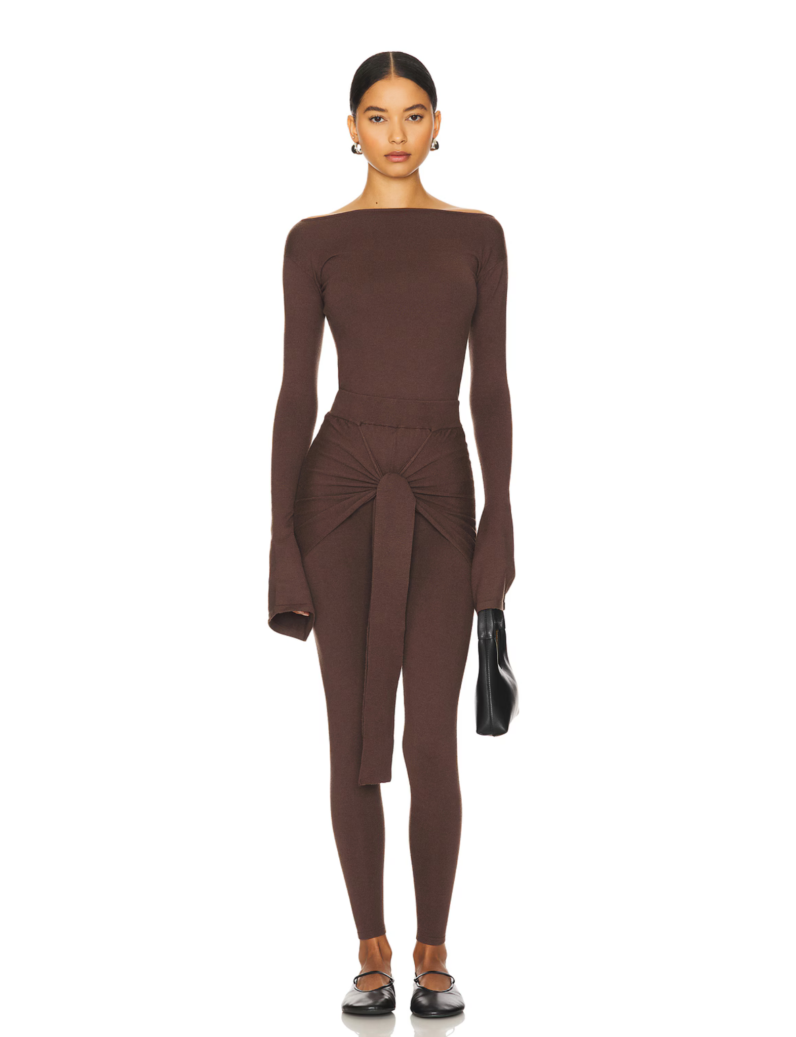 Romy Knit Pants in chocolate brown, featuring a high-waisted fit, soft knit fabric, and a front-tie detail for a stylish and comfortable look. Perfect for casual or elevated cozy outfits

Romy Knit Top styled in a minimalist setting. Featuring a sleek, fitted design with a boat neckline and ribbed texture, it exudes contemporary elegance. Soft lighting and neutral tones enhance its sophisticated appeal.&quot;