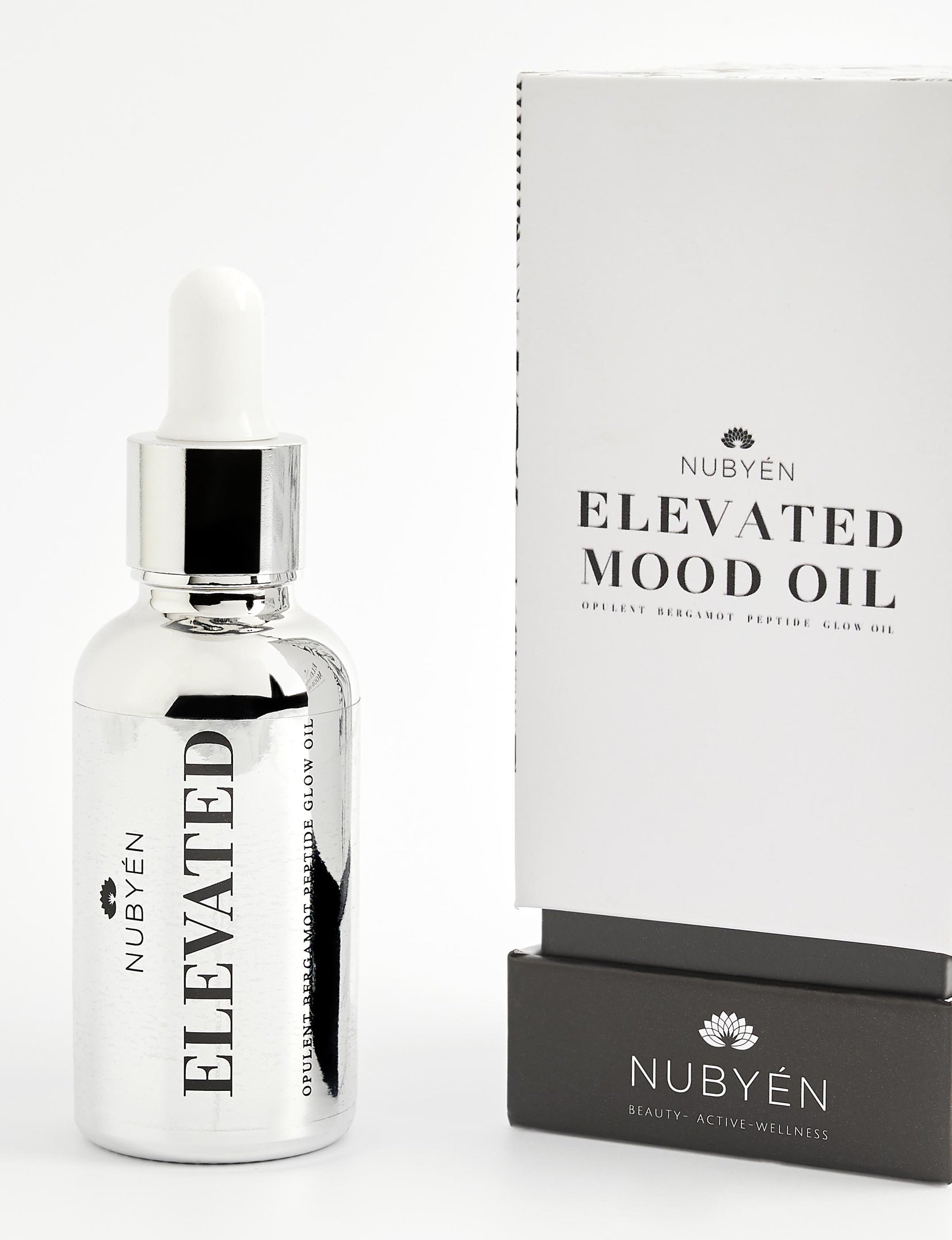 Discover Nubyén Elevated Mood Oil, a hydrating face oil packed with natural ingredients like Camellia Oil, Avocado, Squalene, and Bergamot. This 100% natural, vegan, and cruelty-free formula deeply nourishes, hydrates, and brightens your skin while improving elasticity and reducing wrinkles. Perfect for all skin types, it also enhances your mood with its uplifting scent. Free from sulfates, phthalates, and parabens, this multi-functional oil can also be used for hair, lashes, and brows.