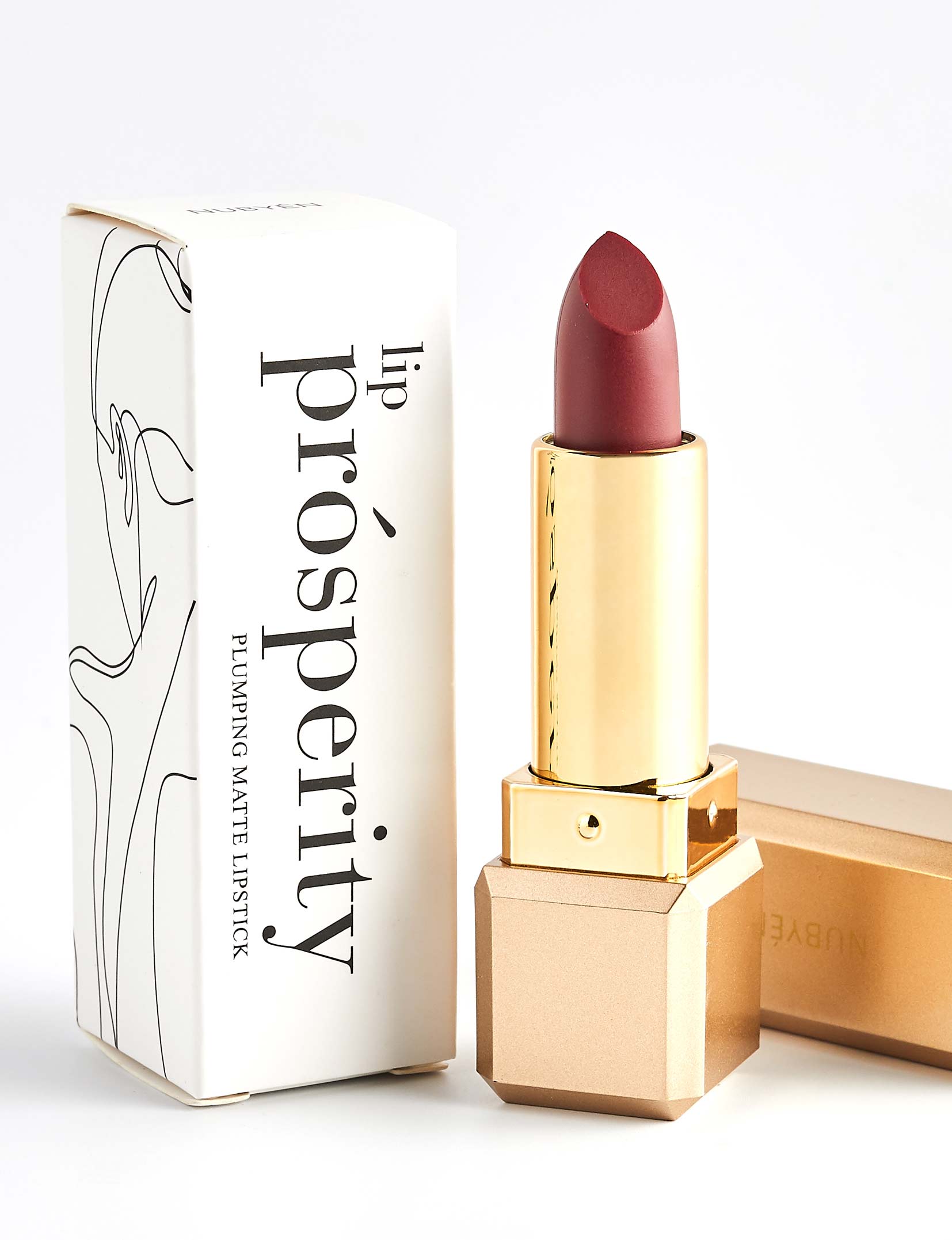 Nubyén Lip Prosperity Plumping Matte Lipstick – A luxurious matte lipstick that plumps, hydrates, and enhances lip volume naturally. Infused with nourishing ingredients like hyaluronic acid and cinnamon, it delivers bold, long-lasting color while keeping lips smooth and moisturized. 100% vegan, cruelty-free, and free from parabens and sulfates, this lipstick is perfect for fuller, healthier-looking lips. Created by medical professionals, it combines beauty and science for confident, radiant results