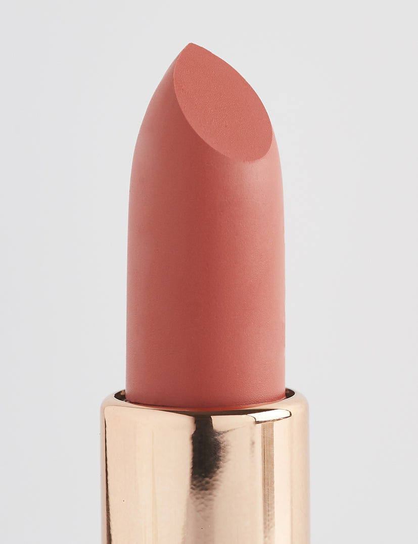 Achieve fuller lips with Nubyén Super Nudes Plumping Lipstick. Vegan, cruelty-free, moisture-matte lipstick infused with peppermint, eucalyptus, lemongrass, and collagen to enhance lip volume naturally. Available in 10 flattering nude shades, perfect for a soft, plump, kissable pout. Safe to use with or without fillers. Clean beauty formula, free of parabens, sulfates, and phthalates.