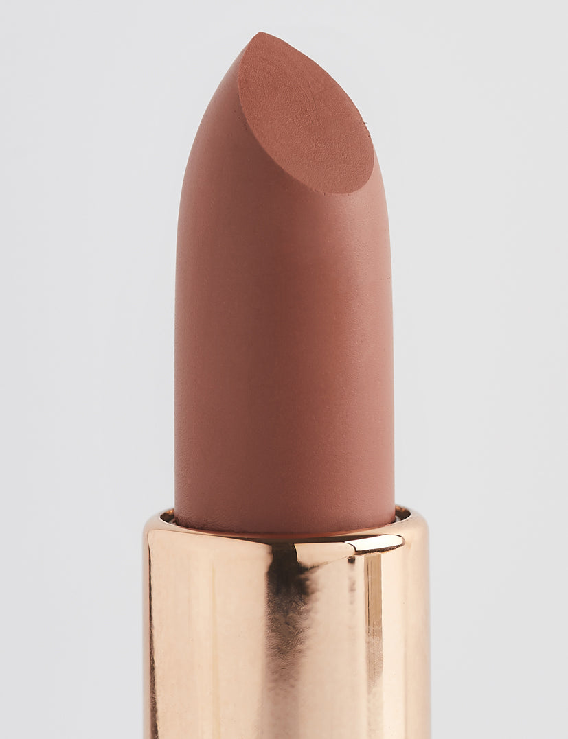 Achieve fuller lips with Nubyén Super Nudes Plumping Lipstick. Vegan, cruelty-free, moisture-matte lipstick infused with peppermint, eucalyptus, lemongrass, and collagen to enhance lip volume naturally. Available in 10 flattering nude shades, perfect for a soft, plump, kissable pout. Safe to use with or without fillers. Clean beauty formula, free of parabens, sulfates, and phthalates.