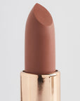 Achieve fuller lips with Nubyén Super Nudes Plumping Lipstick. Vegan, cruelty-free, moisture-matte lipstick infused with peppermint, eucalyptus, lemongrass, and collagen to enhance lip volume naturally. Available in 10 flattering nude shades, perfect for a soft, plump, kissable pout. Safe to use with or without fillers. Clean beauty formula, free of parabens, sulfates, and phthalates.