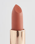 Achieve fuller lips with Nubyén Super Nudes Plumping Lipstick. Vegan, cruelty-free, moisture-matte lipstick infused with peppermint, eucalyptus, lemongrass, and collagen to enhance lip volume naturally. Available in 10 flattering nude shades, perfect for a soft, plump, kissable pout. Safe to use with or without fillers. Clean beauty formula, free of parabens, sulfates, and phthalates.