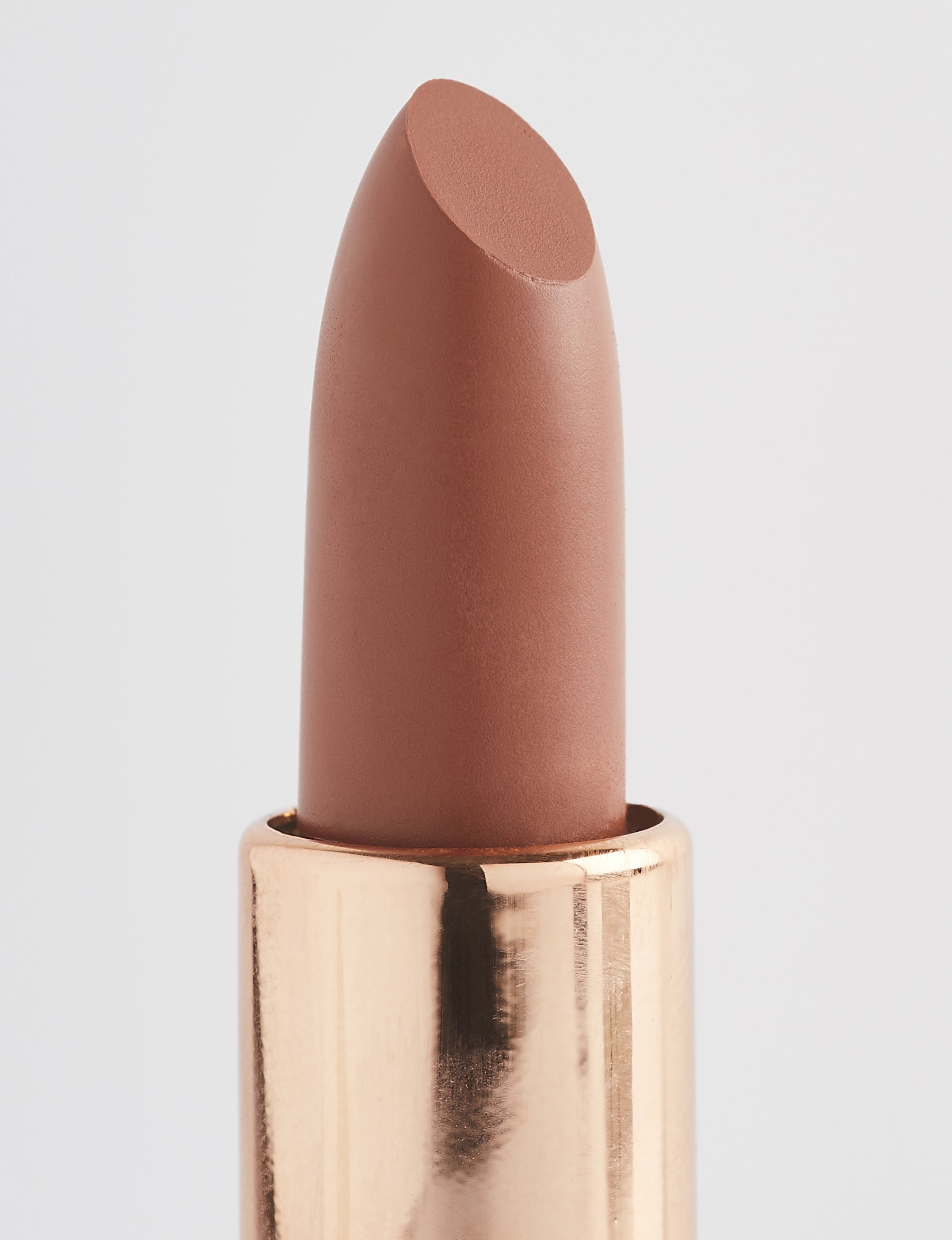 Achieve fuller lips with Nubyén Super Nudes Plumping Lipstick. Vegan, cruelty-free, moisture-matte lipstick infused with peppermint, eucalyptus, lemongrass, and collagen to enhance lip volume naturally. Available in 10 flattering nude shades, perfect for a soft, plump, kissable pout. Safe to use with or without fillers. Clean beauty formula, free of parabens, sulfates, and phthalates.