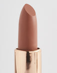 Achieve fuller lips with Nubyén Super Nudes Plumping Lipstick. Vegan, cruelty-free, moisture-matte lipstick infused with peppermint, eucalyptus, lemongrass, and collagen to enhance lip volume naturally. Available in 10 flattering nude shades, perfect for a soft, plump, kissable pout. Safe to use with or without fillers. Clean beauty formula, free of parabens, sulfates, and phthalates.