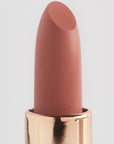 Achieve fuller lips with Nubyén Super Nudes Plumping Lipstick. Vegan, cruelty-free, moisture-matte lipstick infused with peppermint, eucalyptus, lemongrass, and collagen to enhance lip volume naturally. Available in 10 flattering nude shades, perfect for a soft, plump, kissable pout. Safe to use with or without fillers. Clean beauty formula, free of parabens, sulfates, and phthalates.