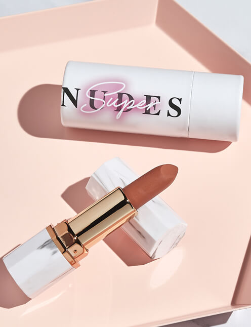 Achieve fuller lips with Nubyén Super Nudes Plumping Lipstick. Vegan, cruelty-free, moisture-matte lipstick infused with peppermint, eucalyptus, lemongrass, and collagen to enhance lip volume naturally. Available in 10 flattering nude shades, perfect for a soft, plump, kissable pout. Safe to use with or without fillers. Clean beauty formula, free of parabens, sulfates, and phthalates.